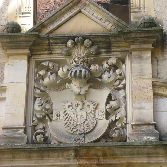 A carved coat of arms inside Bouzov Castle from the Teutonic Order's tenure