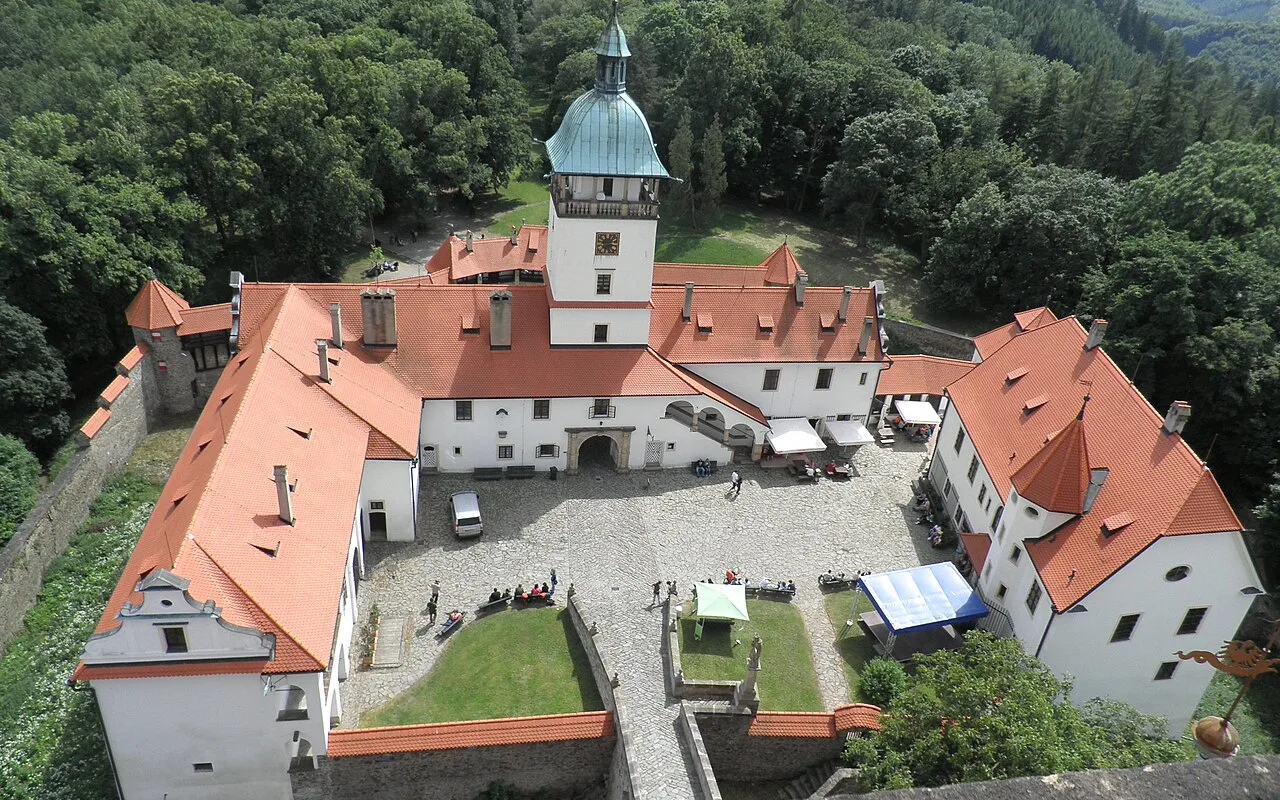 Looking up at Bouzov Castle's tower from within the castle courtyard